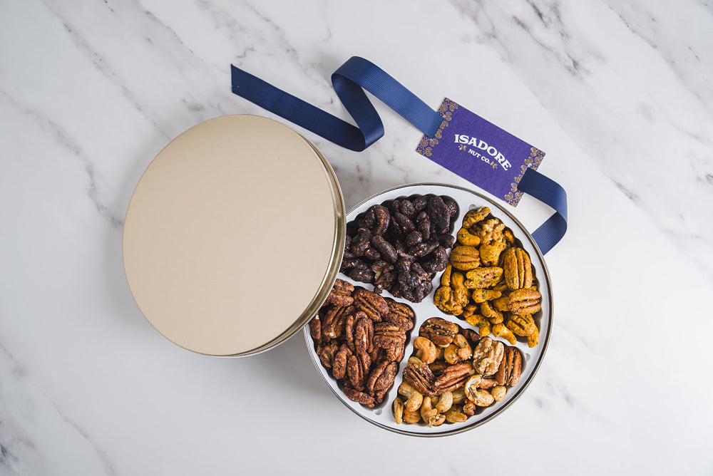 THE MIXED NUT GIFT TIN- Chai, Cocoa Orange, Lemon Rosemary, Turmeric. A curated selection of our best-selling nut blends that makes the perfect gesture.