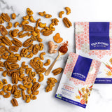 CAYENNE SPICE- Cashews, Pecans, Walnuts Roasted nuts in a fiery blend of spices, and real maple syrup. This spicy trio of seasoned nuts is high in antioxidants thanks to turmeric and black sesame seed. Pair it with a salad or an effervescent to heighten the heat.