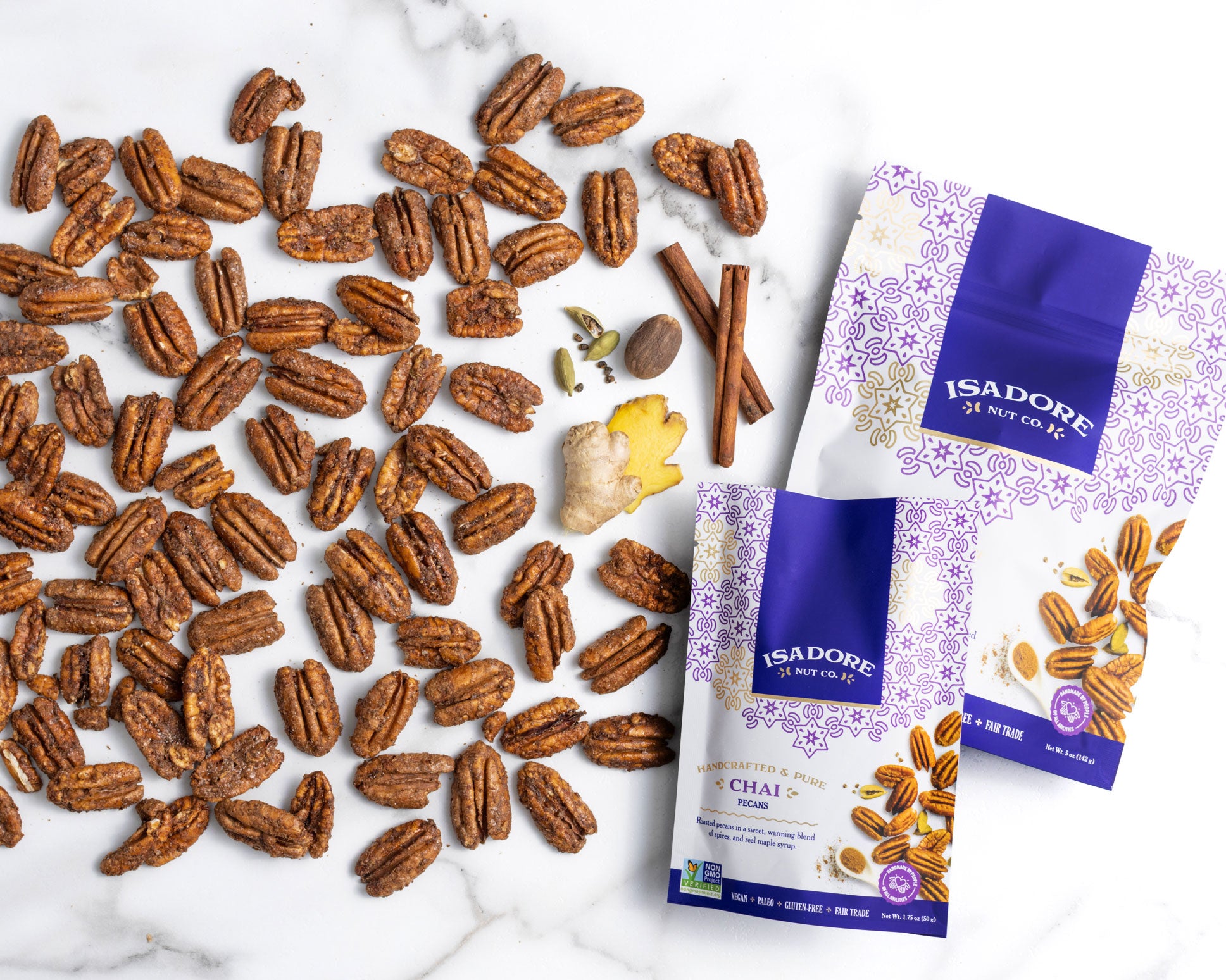 CHAI- Pecans Roasted pecans in a sweet, warming blend of spices, and real maple syrup. An award-winning snack that mimics a warm cup of tea with a unique combination of earthy turmeric, spicy cinnamon and a punch of bright ginger.