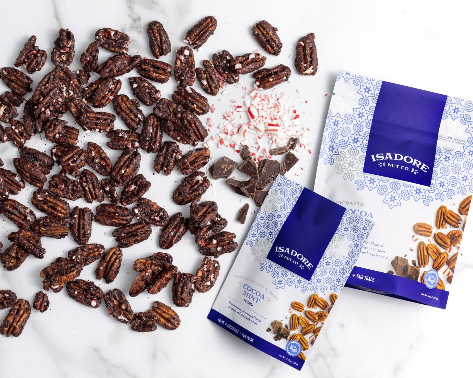COCOA MINT- Pecans Roasted pecans in a seasonal blend of spices, and real maple syrup. Crushed peppermint and decadent cocoa blend couple together to make a seasoned pecan that is both refreshing and sweet.