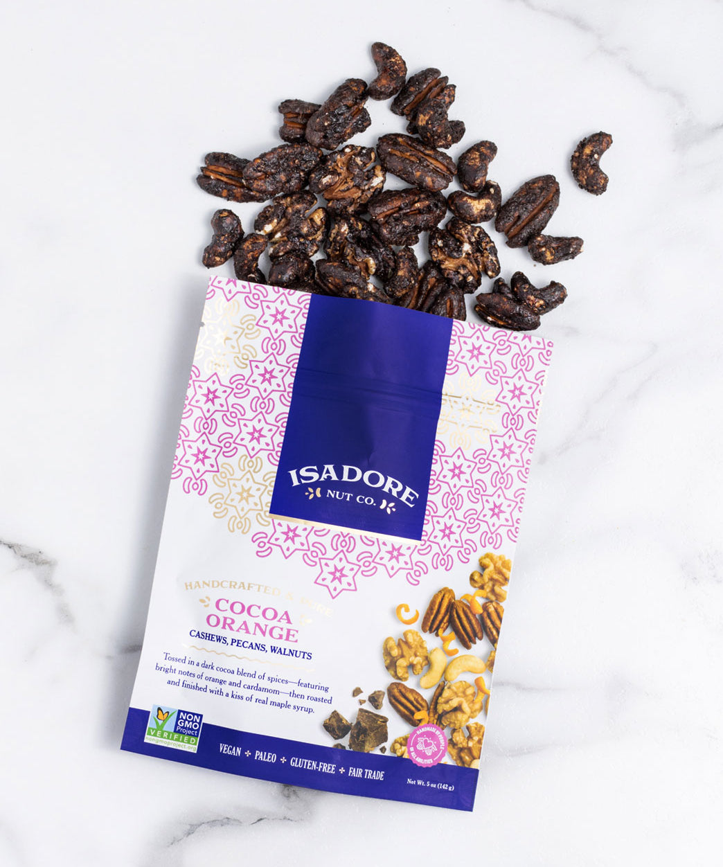 COCOA ORANGE- Cashews, Pecans, Walnuts Roasted nuts in a dark cocoa blend of spices, and real maple syrup. A blend of cocoa, orange and savory-sweet cardamom meld together to create a snack that’s bright, memorable and satisfyingly sweet.