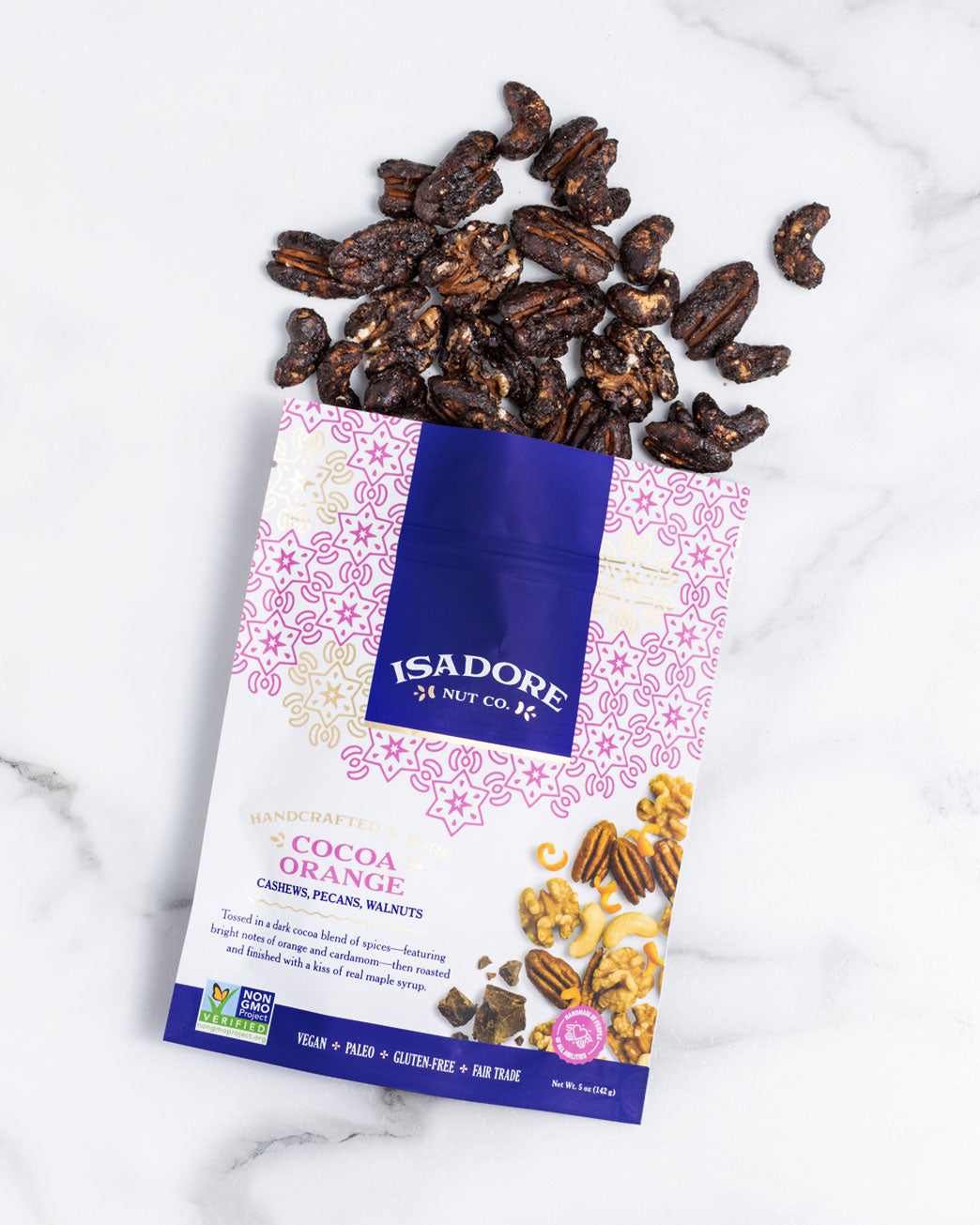 COCOA ORANGE- Cashews, Pecans, Walnuts Roasted nuts in a dark cocoa blend of spices, and real maple syrup. A blend of cocoa, orange and savory-sweet cardamom meld together to create a snack that’s bright, memorable and satisfyingly sweet.